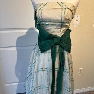 Vintage 1950s dress with a lovely green bow. Strapless gown.